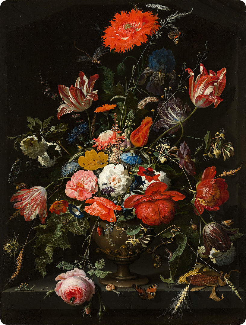 Flowers of multiple different vibrant colors in a pot